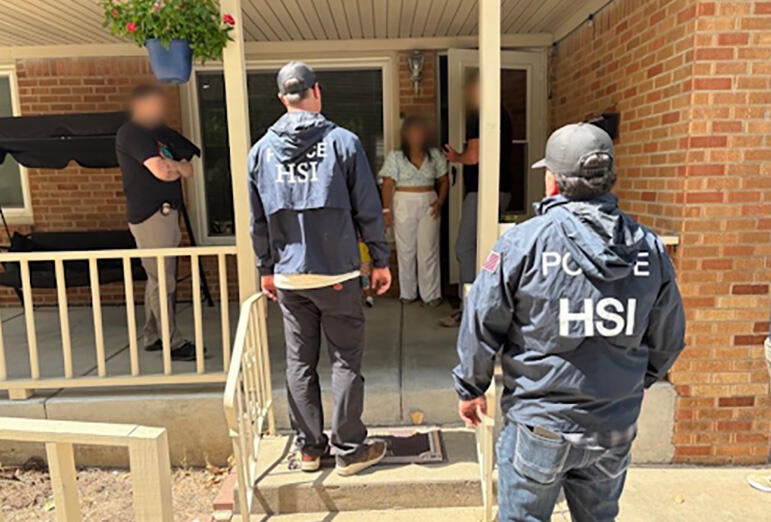 Armed federal agents knock on doors looking for noncitizen voters